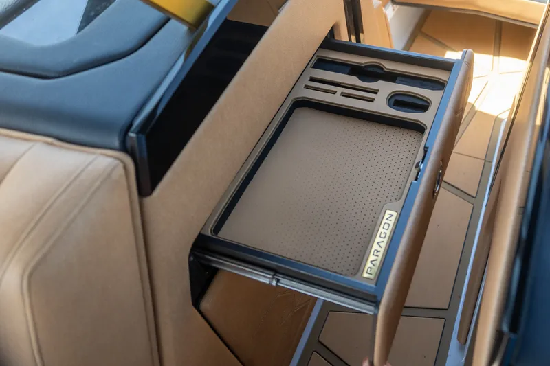 Slide: The Image of 2026 Nautique Super Air Nautique G25 Paragon interior storage compartment detail. - 2