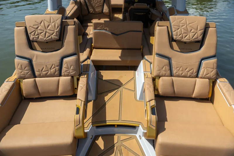 Slide: The Image of Luxurious interior of 2026 Nautique Super Air Nautique G25 Paragon boat with tan seating. - 8