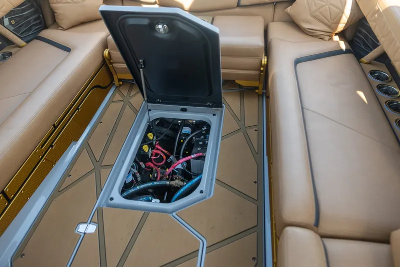 Slide: The Image of 2026 Nautique Super Air Nautique G25 Paragon interior with open engine compartment. - 13