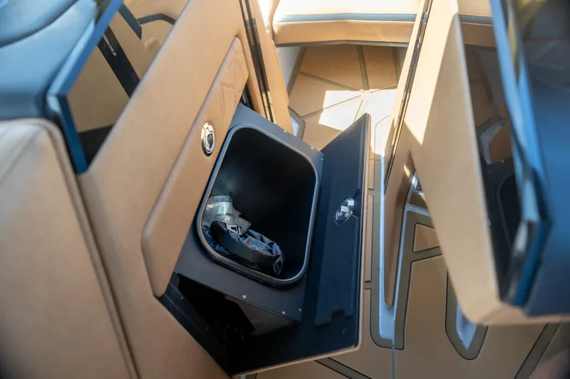 Slide: The Image of Interior storage compartment of 2026 Nautique Super Air Nautique G25 Paragon boat. - 16