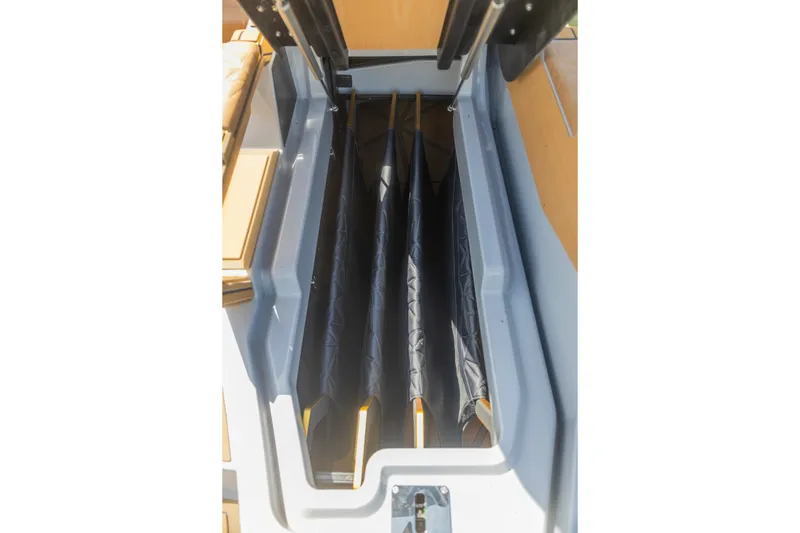 Slide: The Image of 2026 Nautique Super Air Nautique G25 Paragon storage compartment with surfboards. - 24