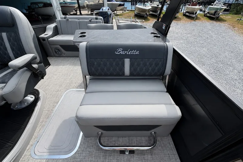 Slide: The Image of Interior of 2026 Barletta Lusso 25UE pontoon boat with luxurious seating. - 26