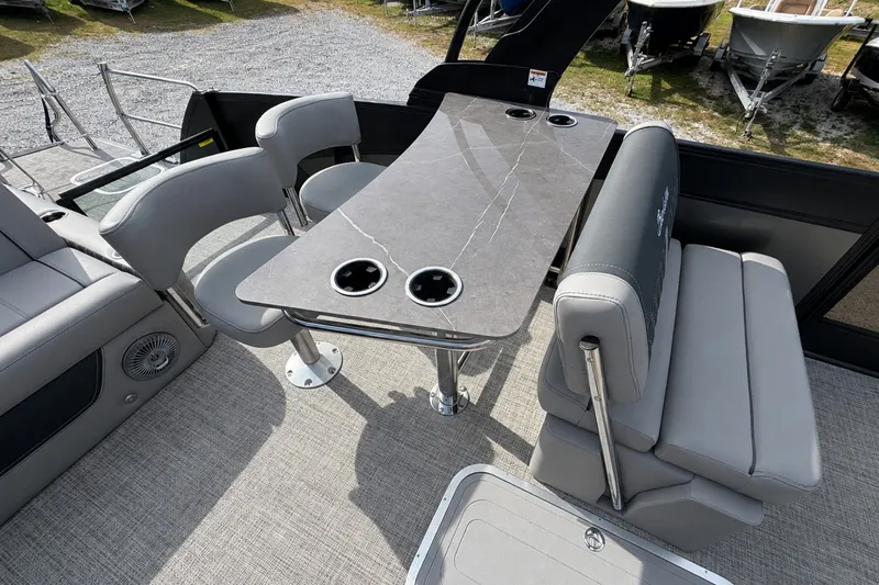 Slide: The Image of 2026 Barletta Lusso 25UE boat interior with sleek seating and modern table design. - 28