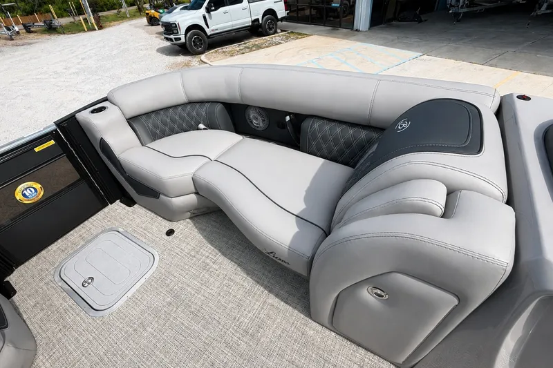 Slide: The Image of Luxurious seating on the 2026 Barletta Lusso 25UE pontoon boat, featuring elegant gray upholstery. - 22