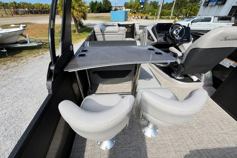 Slide: The Image of Interior of 2026 Barletta Lusso 25UE pontoon boat with seating and table. - 31