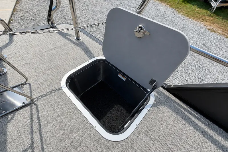 Slide: The Image of Open storage compartment on 2026 Barletta Lusso 25UE boat deck. - 34