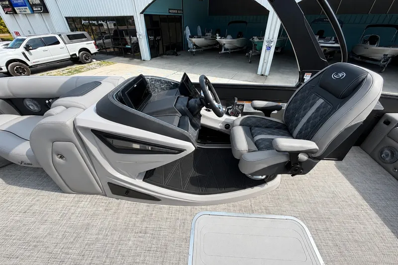 Slide: The Image of Interior of 2026 Barletta Lusso 25UE boat with luxurious seating and modern dashboard. - 24