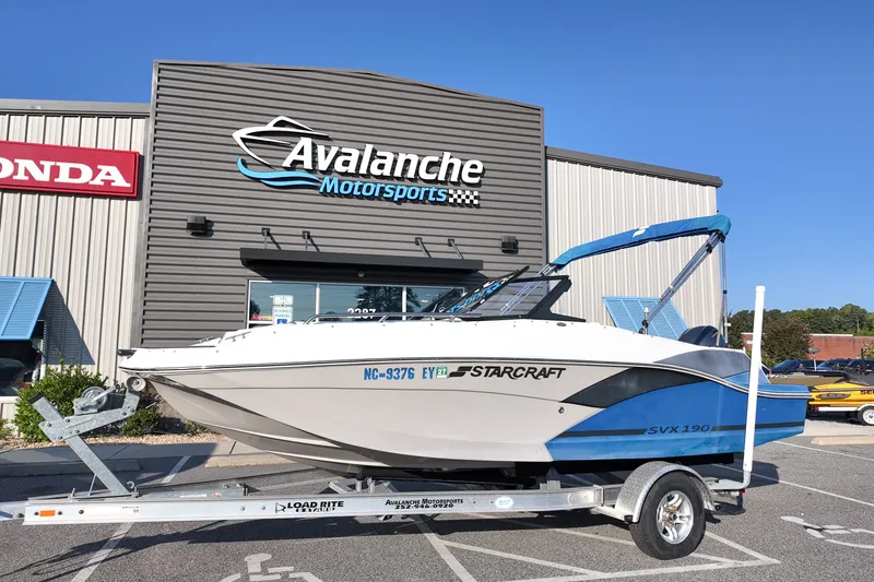The Image of 2023 Starcraft SVX 190 DC OB boat on trailer at Avalanche Motorsports dealership. - 1