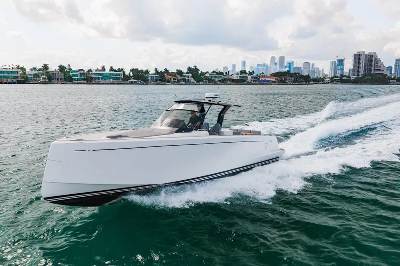 Slide: The Image of 2021 Pardo Yachts P38 cruising on water with city skyline in background. - 17