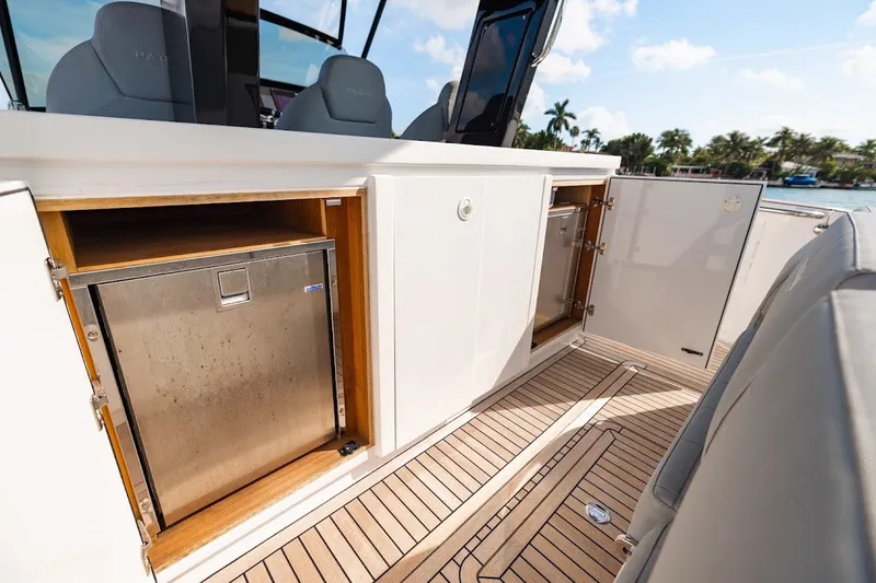 Slide: The Image of 2021 Pardo Yachts P38 interior with open storage compartments and teak flooring. - 46
