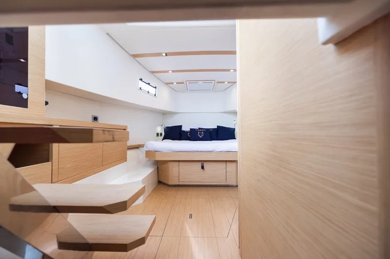 Slide: The Image of Luxurious interior of 2021 Pardo Yachts P38, featuring modern wood finishes and cozy bedding. - 35