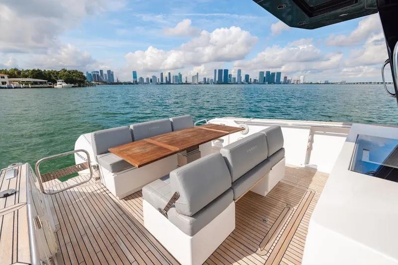 Slide: The Image of Luxurious 2021 Pardo Yachts P38 with elegant deck seating, overlooking a vibrant city skyline. - 30