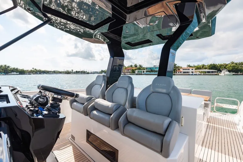 Slide: The Image of Luxury seating on 2021 Pardo Yachts P38, overlooking serene waterfront. - 29