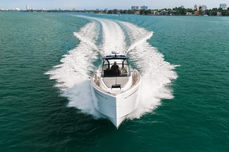 Slide: The Image of 2021 Pardo Yachts P38 cruising on open water, leaving a wake behind. - 14