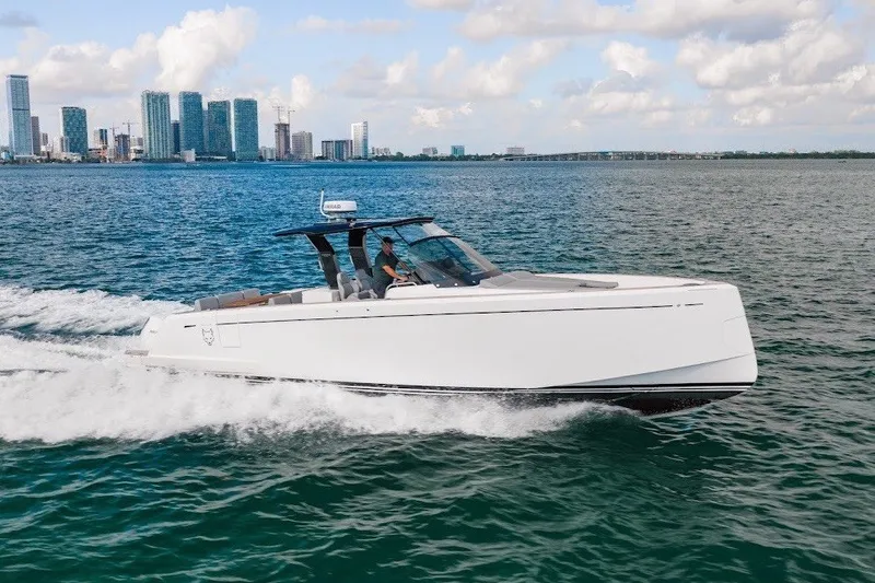 Slide: The Image of 2021 Pardo Yachts P38 cruising on water with city skyline in background. - 19