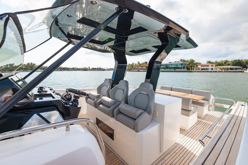 Slide: The Image of Luxurious 2021 Pardo Yachts P38 with sleek seating and modern helm, cruising on serene waters. - 26