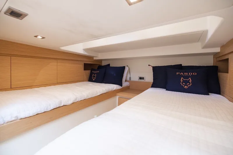 Slide: The Image of Interior cabin of 2021 Pardo Yachts P38 with twin beds and branded pillows. - 38