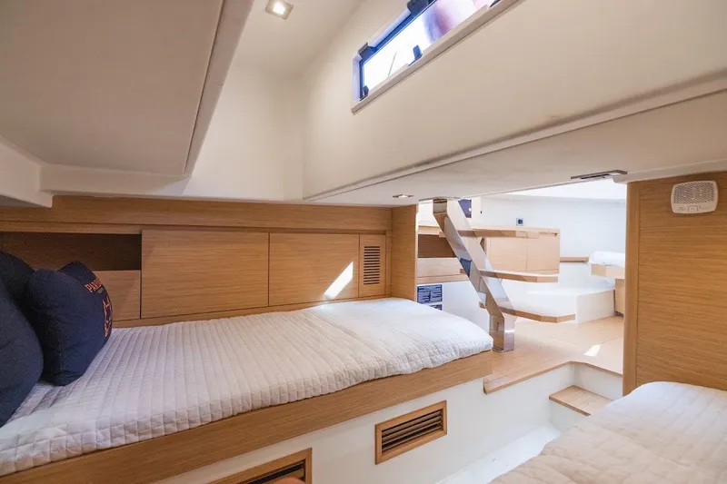 Slide: The Image of Interior of 2021 Pardo Yachts P38, featuring modern wood finishes and cozy sleeping area. - 37