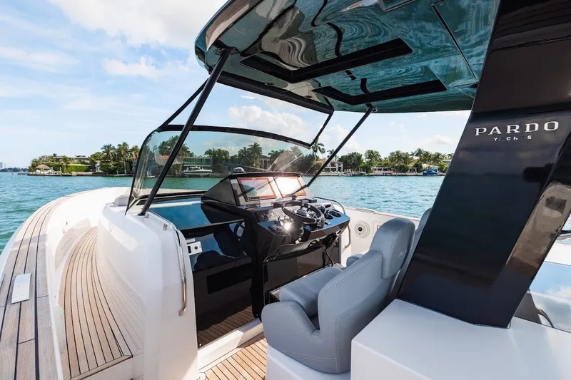 Slide: The Image of 2021 Pardo Yachts P38 luxury yacht cockpit with modern steering and waterfront view. - 27