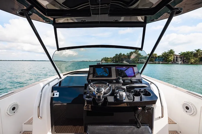 Slide: The Image of Cockpit view of 2021 Pardo Yachts P38 on a sunny day, overlooking calm waters. - 22