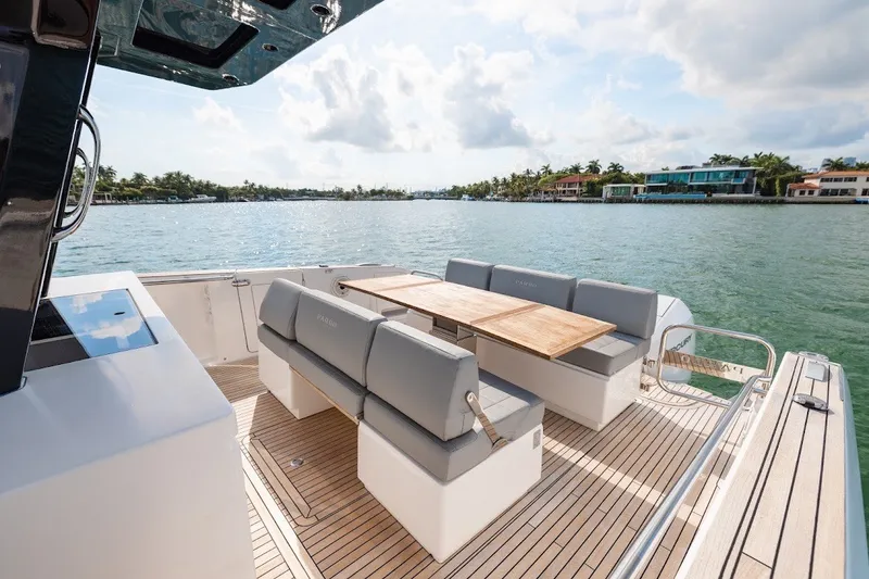 Slide: The Image of Luxurious 2021 Pardo Yachts P38 with elegant seating and scenic waterfront view. - 40