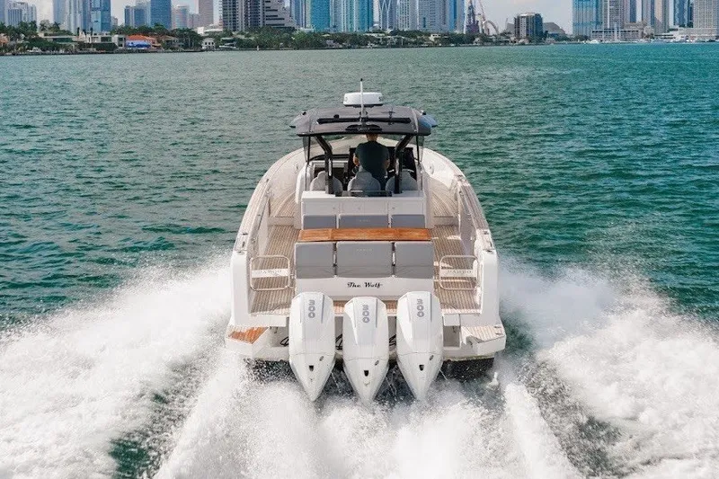 Slide: The Image of 2021 Pardo Yachts P38 cruising on water with city skyline in background. - 13