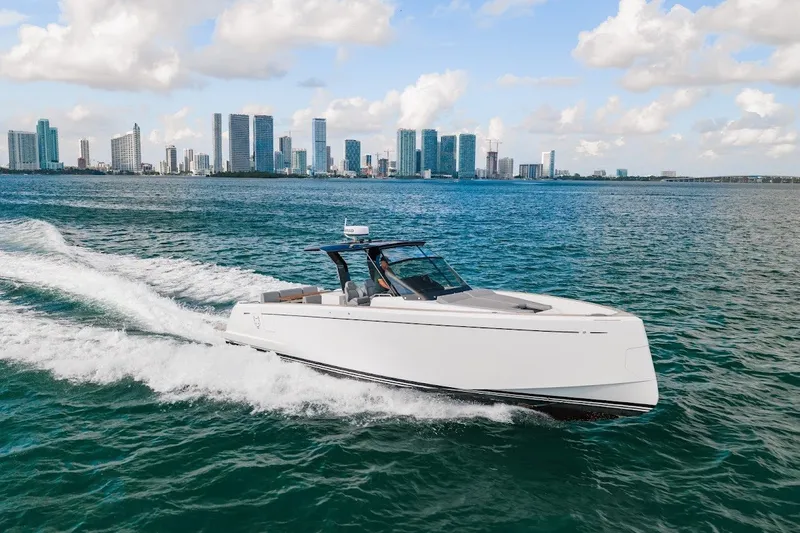 Slide: The Image of 2021 Pardo Yachts P38 cruising on water with city skyline in background. - 20