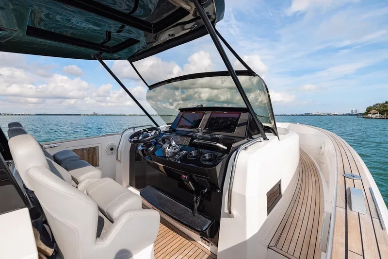 Slide: The Image of 2021 Pardo Yachts P38 helm with modern controls, cruising on open water. - 28