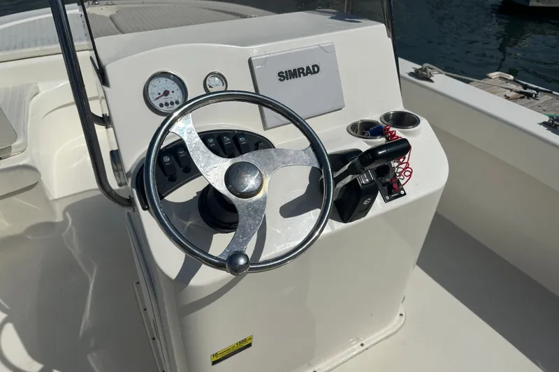 Slide: The Image of Steering console of a 2021 Savannah SS21 boat with Simrad display. - 15