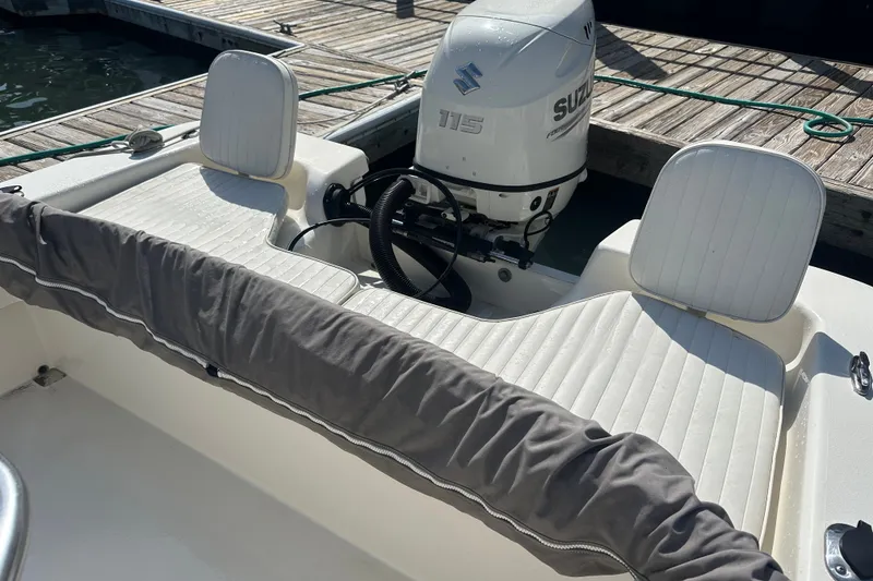 Slide: The Image of 2021 Savannah SS21 boat with Suzuki 115 outboard motor at dock. - 18