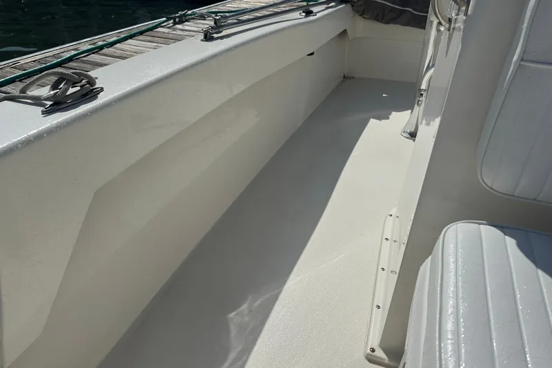 Slide: The Image of Interior view of a 2021 Savannah SS21 boat, showcasing sleek seating and deck design. - 13