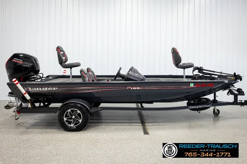 Slide: The Image of 2021 Ranger RT188C fishing boat with Mercury engine, displayed indoors at Reeder Trausch Marine. - 3