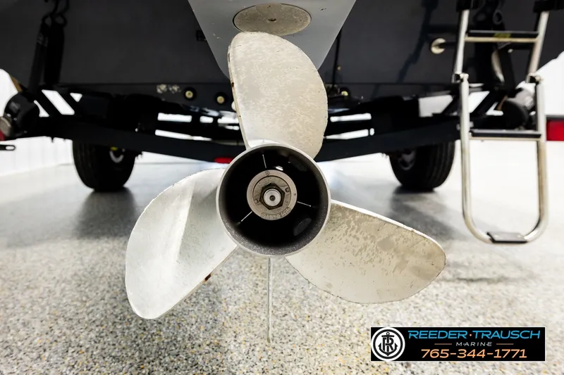 Slide: The Image of Propeller of a 2021 Ranger RT188C boat on a trailer in a showroom. - 49
