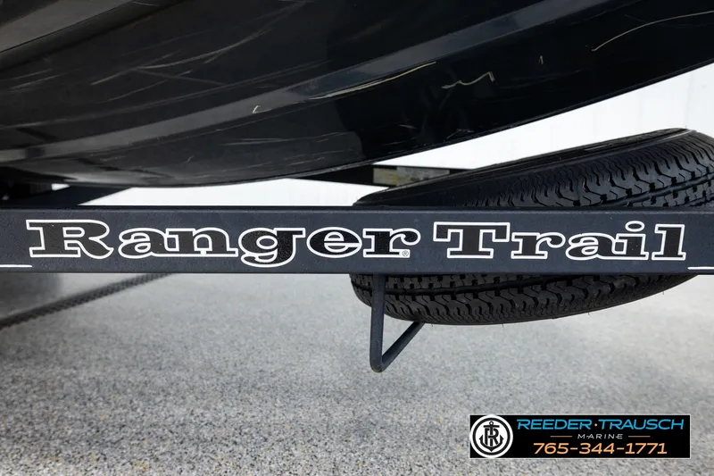 Slide: The Image of 2021 Ranger RT188C boat trailer with visible tire and branding, Reeder-Trausch Marine contact info. - 53