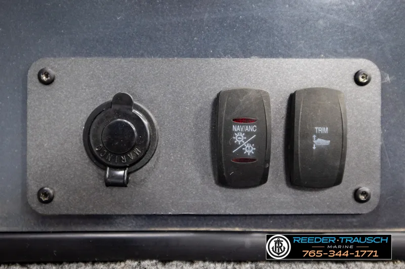 Slide: The Image of Control panel of a 2021 Ranger RT188C boat with navigation and trim switches. - 45