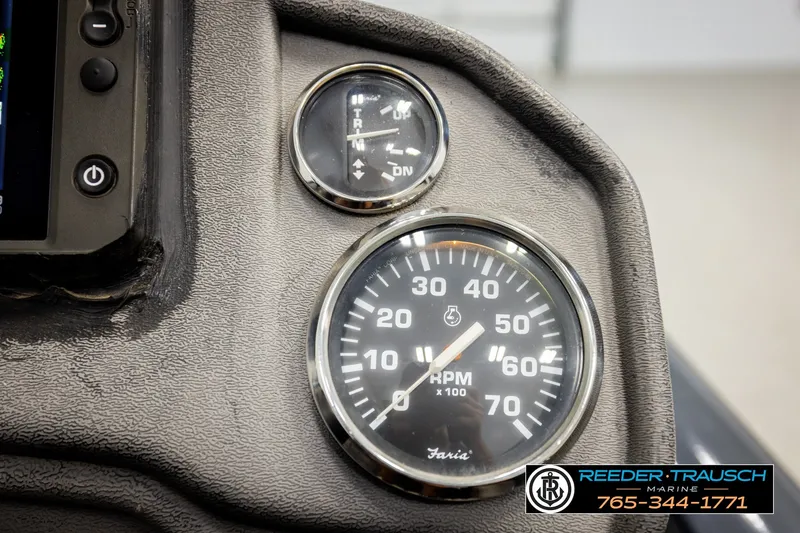 Slide: The Image of Dashboard of 2021 Ranger RT188C boat showing RPM and trim gauges. - 33