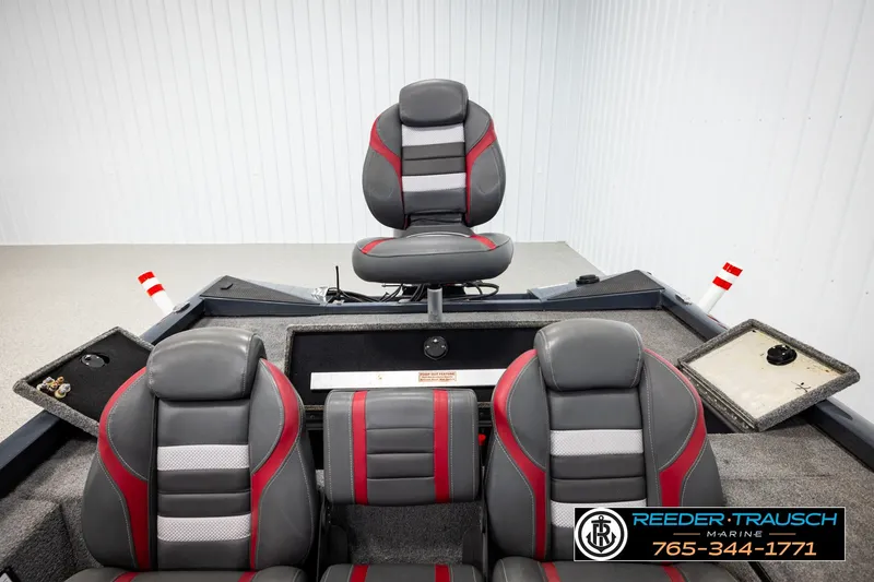 Slide: The Image of 2021 Ranger RT188C boat interior with gray and red seating, Reeder-Trausch Marine branding. - 17