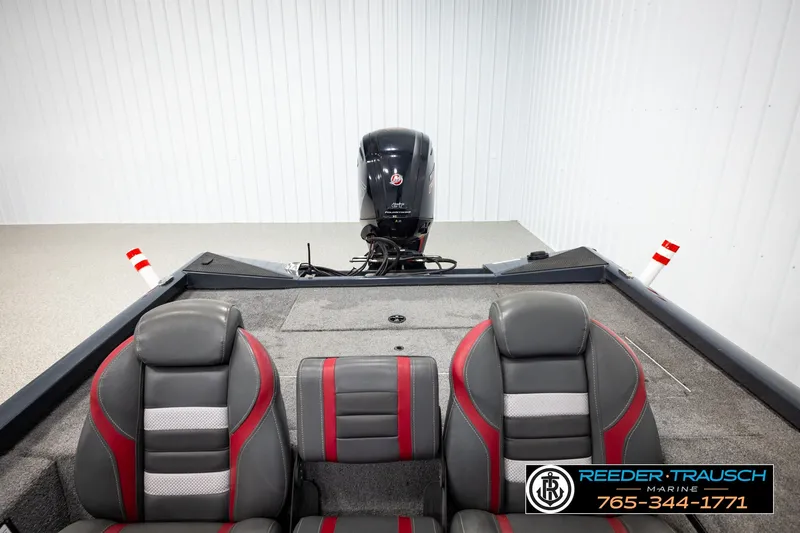 Slide: The Image of 2021 Ranger RT188C boat interior with dual gray and red seats, motor visible in background. - 18