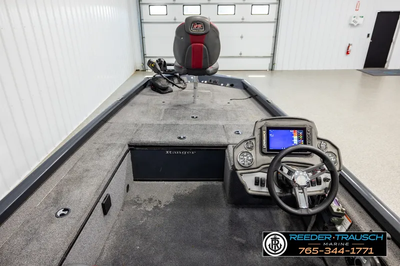 Slide: The Image of 2021 Ranger RT188C boat interior with steering wheel and navigation display. - 12