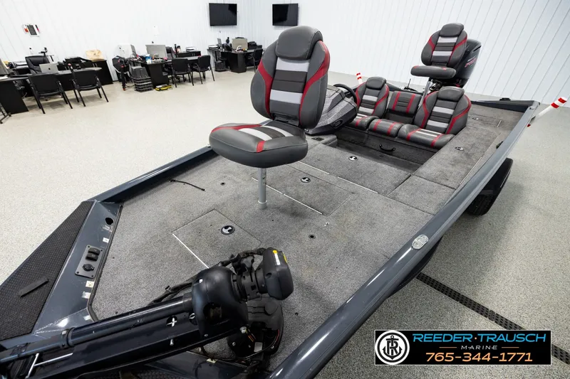Slide: The Image of 2021 Ranger RT188C fishing boat interior with seating and equipment in showroom. - 8