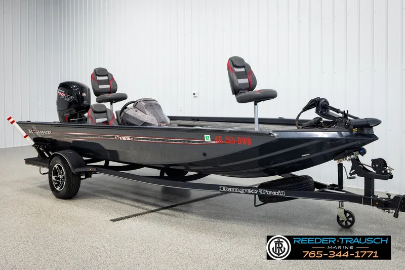 Slide: The Image of 2021 Ranger RT188C fishing boat on trailer in showroom setting. - 2
