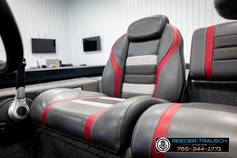 Slide: The Image of 2021 Ranger RT188C boat interior with gray and red seats, Reeder Trausch Marine branding. - 37