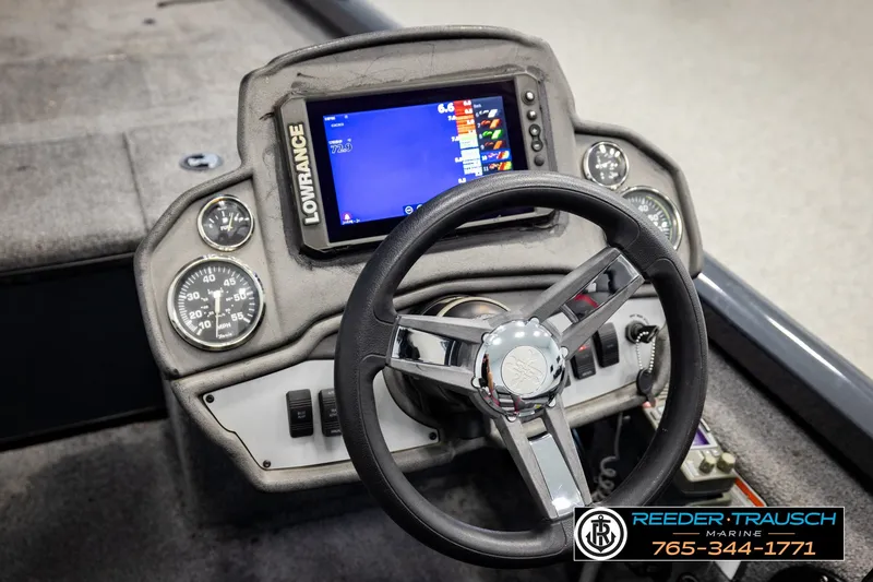 Slide: The Image of 2021 Ranger RT188C boat dashboard with Lowrance display and steering wheel. - 28