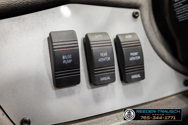 Slide: The Image of Control panel of a 2021 Ranger RT188C boat with bilge pump and aerator switches. - 30