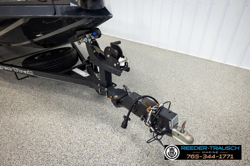 Slide: The Image of Trailer hitch of a 2021 Ranger RT188C boat in a showroom setting. - 51