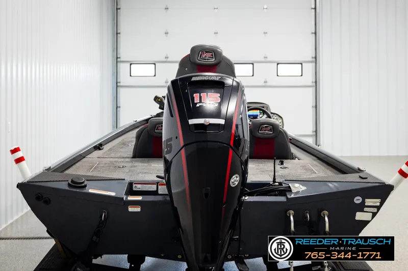 Slide: The Image of 2021 Ranger RT188C boat with Mercury 115 engine in a garage setting. - 5