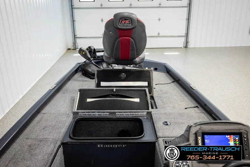 Slide: The Image of 2021 Ranger RT188C fishing boat interior with storage compartments and control panel. - 24