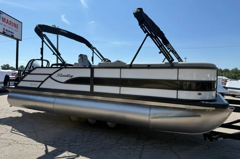 The Image of 2026 Bentley Pontoons Legacy 223 Swingback pontoon boat displayed outdoors. - 0