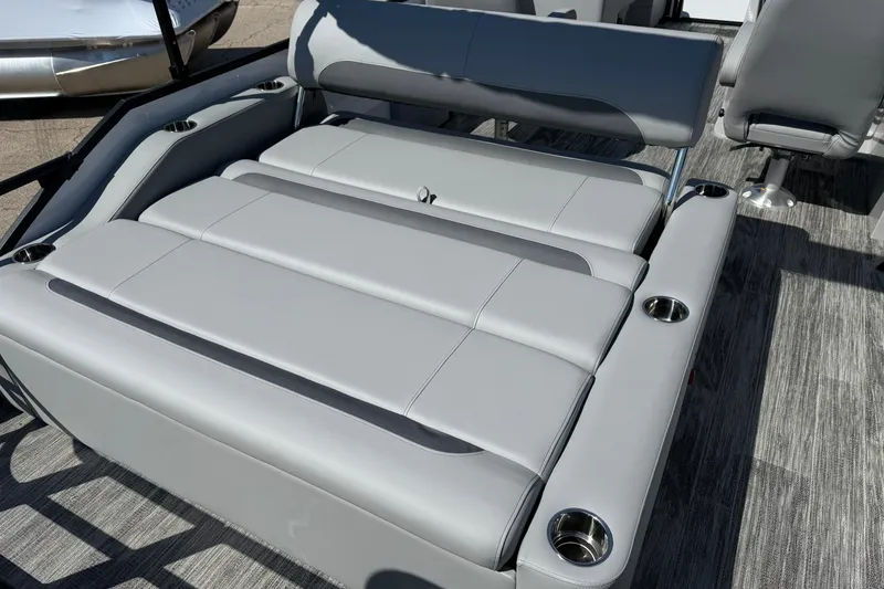 Slide: The Image of 2026 Bentley Pontoons Legacy 223 Swingback with luxurious gray seating and cup holders. - 17