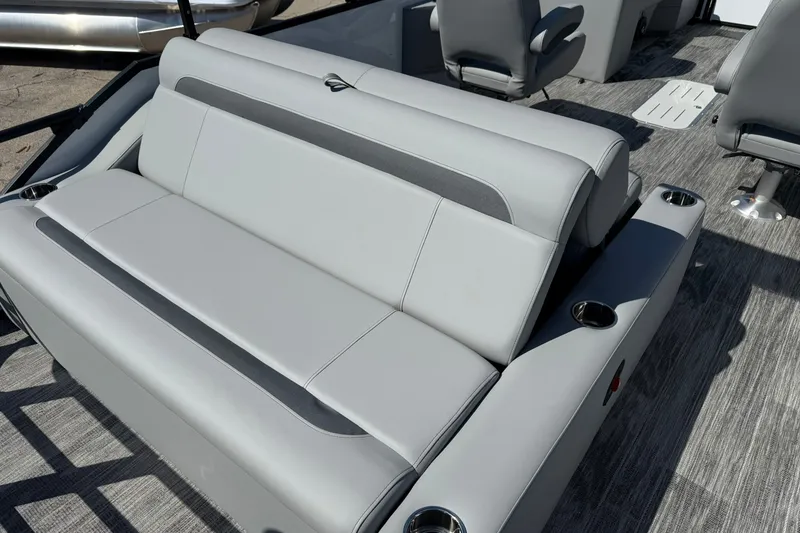 Slide: The Image of 2026 Bentley Pontoons Legacy 223 Swingback interior with sleek gray seating and cup holders. - 15